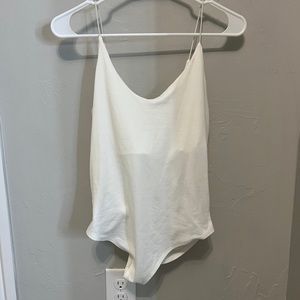 White gaze body suit. Never worn. size M.